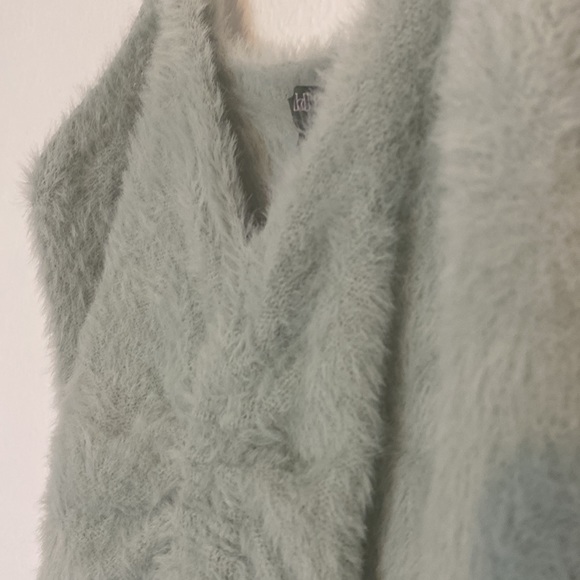 100% Nylon. You can untie the string in front. Never worn. No tags. - Picture 2 of 2